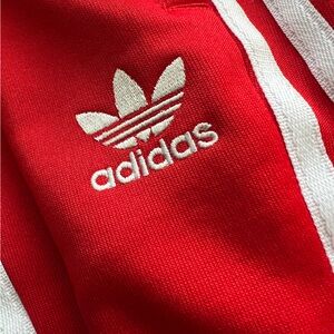 ADICOLOR CLASSICS SST TRACK PANTS | RED